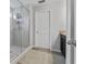 Modern bathroom featuring a glass-enclosed shower and a vanity at 2620 Waterline St, Kissimmee, FL 34743