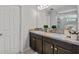 Clean bathroom features double sinks, vanity, and a shower with glass door at 2620 Waterline St, Kissimmee, FL 34743