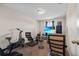 Cozy bedroom setup with exercise bike, media center, and comfortable chairs at 2620 Waterline St, Kissimmee, FL 34743