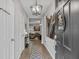 Inviting entryway with tile flooring, decorative lighting, and an artistic Eiffel Tower accent piece at 2620 Waterline St, Kissimmee, FL 34743