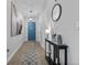 Welcoming entryway with neutral tones, tile flooring, and a decorative Eiffel Tower art piece at 2620 Waterline St, Kissimmee, FL 34743