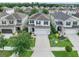 Two-story home featuring a well-manicured lawn, a two-car garage, and classic curb appeal at 2620 Waterline St, Kissimmee, FL 34743