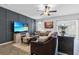 Comfortable living room with a modern media wall, plush seating, and stylish decor at 2620 Waterline St, Kissimmee, FL 34743