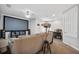Living room with large screen and projector, comfortable seating and open floor plan at 2620 Waterline St, Kissimmee, FL 34743