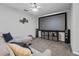 Spacious media room with a large screen, surround sound speakers, and comfortable seating for movie nights at 2620 Waterline St, Kissimmee, FL 34743