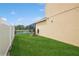 Well-maintained backyard with lush green grass and privacy fence at 2659 Magpie Way, Sanford, FL 32773