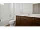 Bathroom with tiled shower and updated vanity featuring modern fixtures and neutral paint at 2659 Magpie Way, Sanford, FL 32773