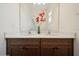 Bathroom features a double vanity with sleek countertops and modern fixtures, creating a functional space at 2659 Magpie Way, Sanford, FL 32773