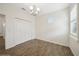 Comfortable bedroom with wood-look tile flooring and bright natural light at 2659 Magpie Way, Sanford, FL 32773