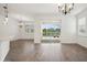 Open-concept dining area featuring sliding glass doors to the outdoor pool and tiled flooring at 2659 Magpie Way, Sanford, FL 32773