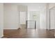 Bright hallway with hardwood floors and open design offers a welcoming transition between living spaces at 2659 Magpie Way, Sanford, FL 32773