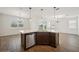 Modern kitchen island featuring pendant lights, stainless steel appliances, and an open floor plan at 2659 Magpie Way, Sanford, FL 32773