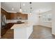 Bright kitchen with stainless steel appliances, a large island, and sleek countertops and backsplash at 2659 Magpie Way, Sanford, FL 32773