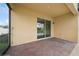Covered patio with brick flooring offers a view of the screened pool at 2659 Magpie Way, Sanford, FL 32773