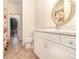 Well-lit bathroom featuring ceramic floors, vanity sink, and separate toilet at 2691 Phillips Rd, Christmas, FL 32709