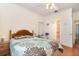 Bedroom with hardwood floors, side tables, and en-suite bathroom at 2691 Phillips Rd, Christmas, FL 32709