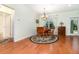 Charming dining area featuring hardwood floors, natural light, and views of the backyard at 2691 Phillips Rd, Christmas, FL 32709