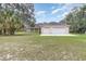 Large detached two-car garage with ample space, adjacent to the single-story home at 2691 Phillips Rd, Christmas, FL 32709