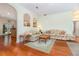 Inviting living room featuring hardwood floors, natural light, and archways leading to adjacent spaces at 2691 Phillips Rd, Christmas, FL 32709