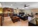 Entertainer's basement featuring a wet bar, living room with large leather sectional, and music space at 2750 Lee Shore Loop, Orlando, FL 32820