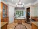 Bathroom featuring a soaking tub under a window, chandelier and a vanity at 2750 Lee Shore Loop, Orlando, FL 32820