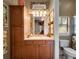 Bright bathroom features a single sink vanity and decorative mirror with abundant lighting at 2750 Lee Shore Loop, Orlando, FL 32820