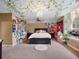 Whimsical bedroom with ivy accents, string lights, and a comfortable bed and ceiling fan at 2750 Lee Shore Loop, Orlando, FL 32820