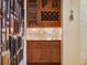Butler's pantry features custom wood cabinets, wine rack, and elegant granite countertops at 2750 Lee Shore Loop, Orlando, FL 32820