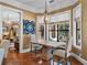 Dining room with natural light, stylish chandelier, and wood table at 2750 Lee Shore Loop, Orlando, FL 32820