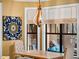 Dining space with view to pool area and modern lighting fixture at 2750 Lee Shore Loop, Orlando, FL 32820