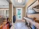 Charming foyer with decorative tile flooring, a console table, and a stylish front door with glass detailing at 2750 Lee Shore Loop, Orlando, FL 32820