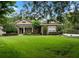 Beautiful one-story home featuring lush green lawn and meticulously landscaped front yard at 2750 Lee Shore Loop, Orlando, FL 32820
