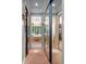 Hallway between bedroom and bathroom featuring full-length mirrors and accent lighting at 2750 Lee Shore Loop, Orlando, FL 32820