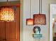 Close up view of kitchen lighting with unique fixtures adding warmth and character at 2750 Lee Shore Loop, Orlando, FL 32820