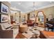 Spacious living room featuring stylish furniture, a decorative rug, hardwood floors, and plenty of natural light at 2750 Lee Shore Loop, Orlando, FL 32820
