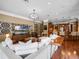 Inviting living area connects to the kitchen with a large sectional and statement lighting fixture at 2750 Lee Shore Loop, Orlando, FL 32820