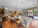 Open floor plan with living area leading to kitchen and outdoor patio with pool at 2750 Lee Shore Loop, Orlando, FL 32820