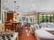 Expansive living area with kitchen and dining space, flooded with natural light, and stylish furniture at 2750 Lee Shore Loop, Orlando, FL 32820