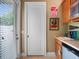 Mud room features tile flooring, cabinets, sink and access to outside at 2750 Lee Shore Loop, Orlando, FL 32820