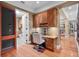 Bright office space with built-in cabinetry and hardwood floors offers functional style at 2750 Lee Shore Loop, Orlando, FL 32820
