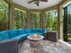 Cozy outdoor patio with a fire pit, comfortable seating, and views of the surrounding natural landscape at 2750 Lee Shore Loop, Orlando, FL 32820