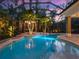 Inviting pool area with palm trees and gazebo featuring outdoor seating at 2750 Lee Shore Loop, Orlando, FL 32820