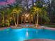Inviting pool area with palm trees and gazebo featuring outdoor seating at 2750 Lee Shore Loop, Orlando, FL 32820