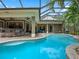 Enjoy a large screened-in pool with a sun shelf and lush landscaping creating a private backyard retreat at 2750 Lee Shore Loop, Orlando, FL 32820