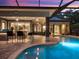 Beautiful outdoor entertaining area featuring a bar, and a covered seating area by the pool at 2750 Lee Shore Loop, Orlando, FL 32820