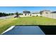 Expansive backyard featuring lush green grass and the early stages of construction on a beautiful home at 2807 Alder Berry Blvd, Ocoee, FL 34761