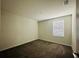 Carpeted bedroom featuring window and neutral paint at 2807 Alder Berry Blvd, Ocoee, FL 34761