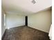 Carpeted empty bedroom with window and neutral paint at 2807 Alder Berry Blvd, Ocoee, FL 34761