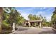 Welcoming community entrance featuring stone architecture, mature trees, and a secure gated entry at 2807 Alder Berry Blvd, Ocoee, FL 34761