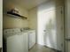 Laundry room with washer, dryer, and shelf at 2807 Alder Berry Blvd, Ocoee, FL 34761